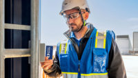 construction worker swiping his ID at a jobsite