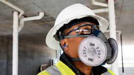 construction worker wearing a respirator