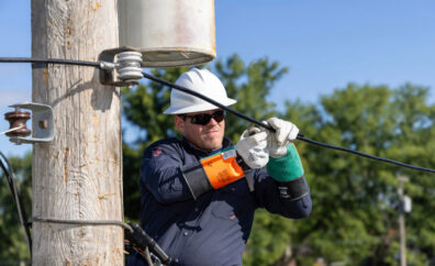 man performing work on electrical line